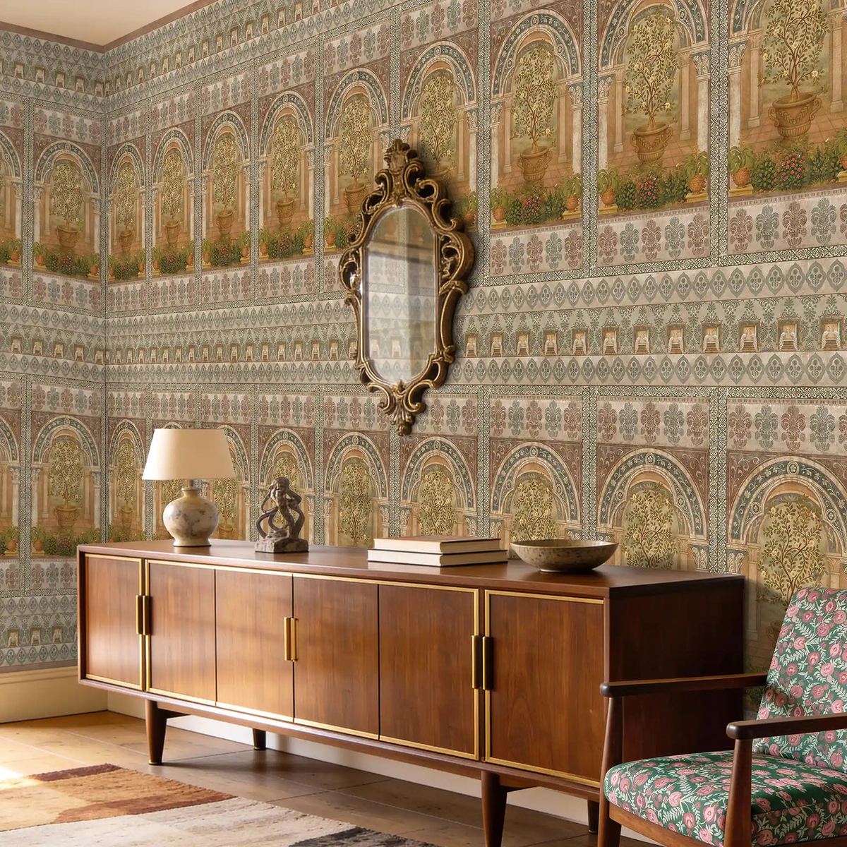 Heritage Indian mural wallpaper with arched botanical alcoves above a mid-century console with gilt mirror — recent installation by Siddhi Decorators